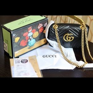 Black quilted bag with gold hardware